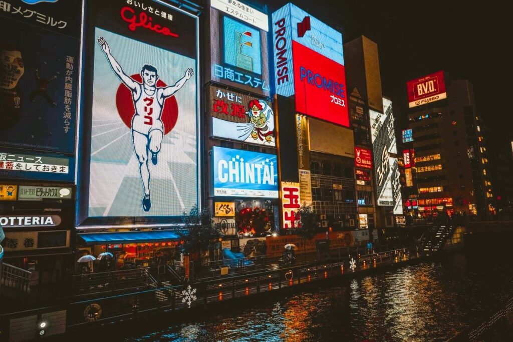 Osaka Glico Man at night Osaka Glico Man poster - Japan Travel Guide