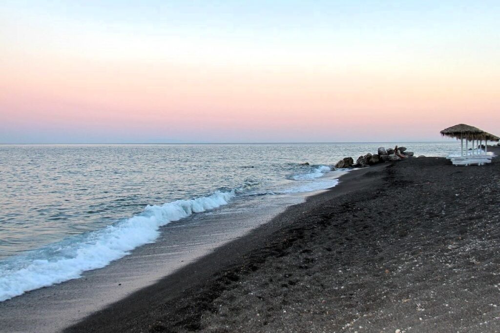 Perissa black beach in Santorini Island Greece