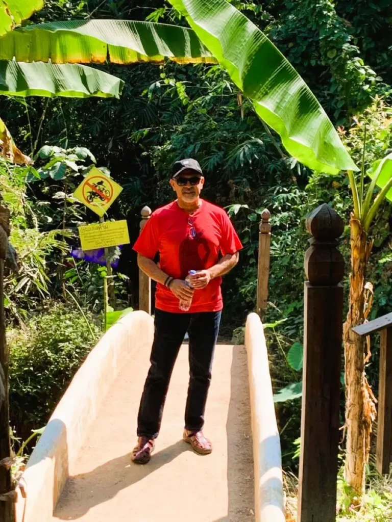 Wat Pha Lat - Nusi on a footbridge surrounded by beautiful nature