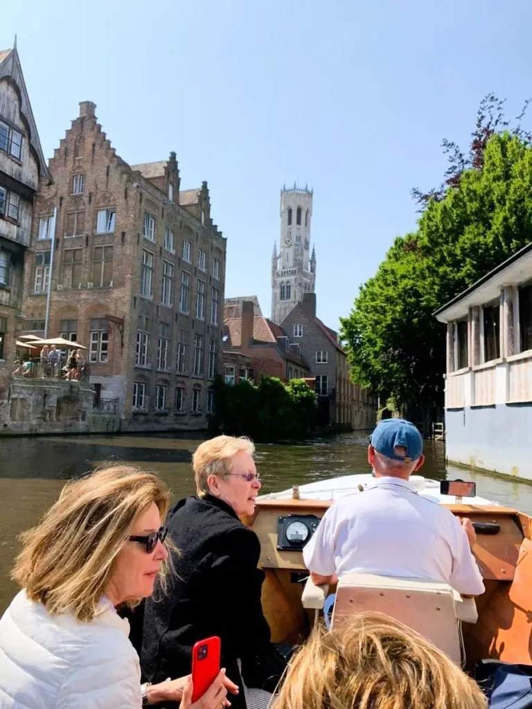View of Belfry Tower from a canal boat ride in Bruges