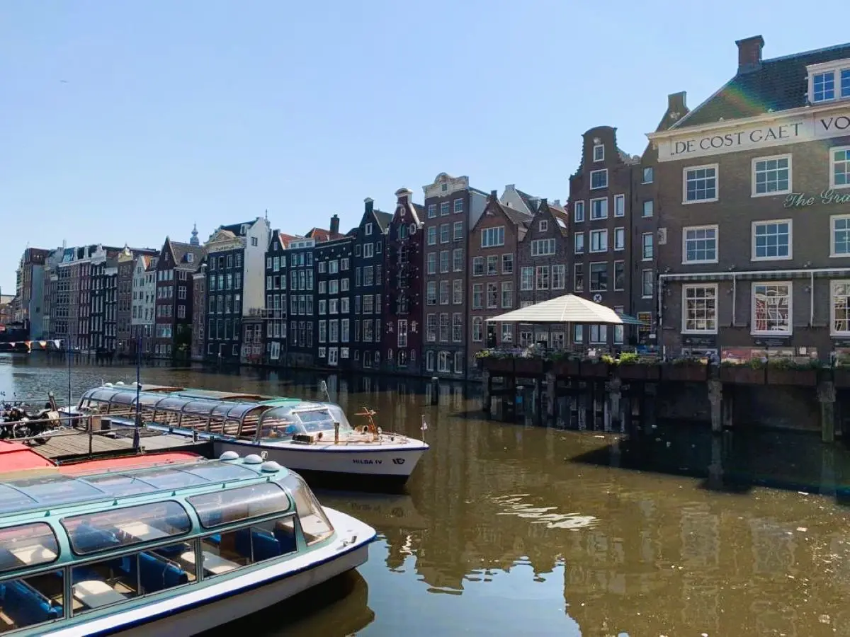 Canal, boats, and 17th-century architecture - Best things to do in Amsterdam